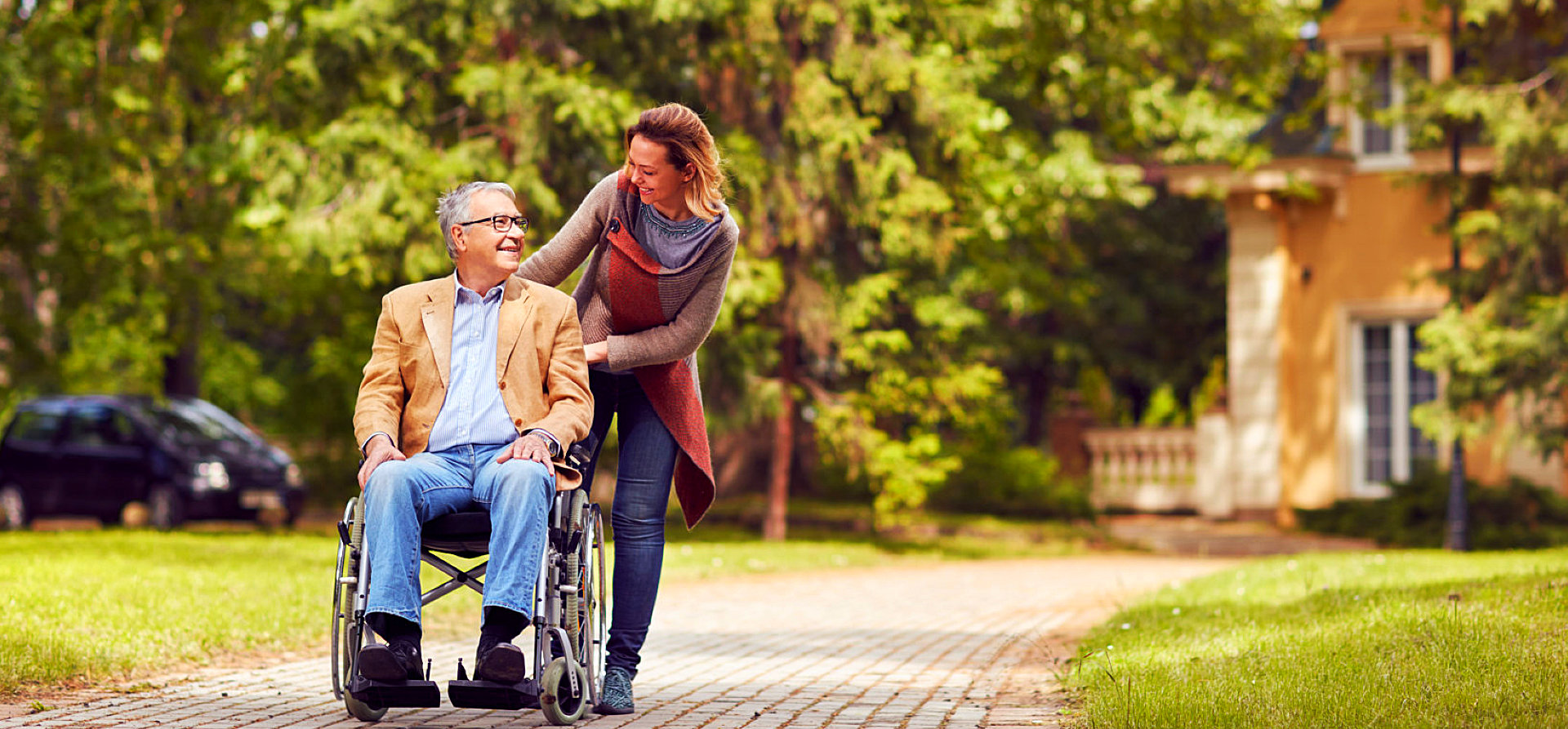 caregiver hugging senior woman